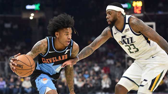 Kevin Porter Jr. drives against Utah Jazz forward Royce O'Neale